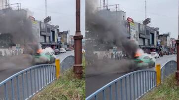 BMW car caught fire in the middle of the road in the middle of the rain at chennai video viral akb BMW car caught fire in the middle of the road in the middle of the rain at chennai video viral akb