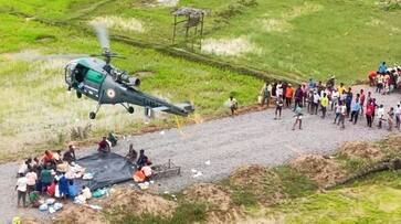 IAF helicopters dropped 600kg of food packets in flood-affected regions of Telangana ksp IAF helicopters dropped 600kg of food packets in flood-affected regions of Telangana ksp