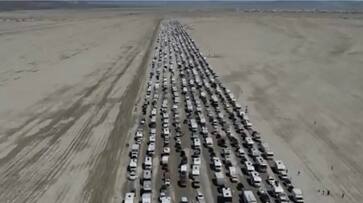 WATCH Dramatic videos of long queues of vehicles leaving Burning Man Festival in Nevada go viral snt WATCH Dramatic videos of long queues of vehicles leaving Burning Man Festival in Nevada go viral snt