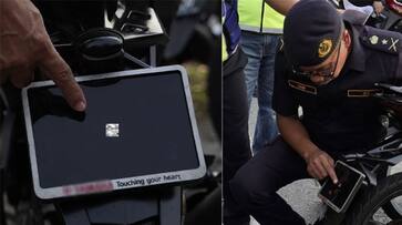 Malaysian motorcyclist had a smallest number plate in his two wheeler police may fine for breaking law ans Malaysian motorcyclist had a smallest number plate in his two wheeler police may fine for breaking law ans