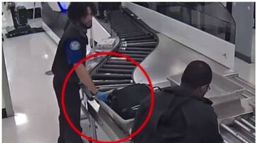 CCTV footage of an airport security officer stealing money from passengers luggage has gone viral bkg CCTV footage of an airport security officer stealing money from passengers luggage has gone viral bkg