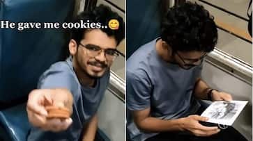 Heartwarming train exchange! Man offers cookies to artist; what he got in return will warm your heart - WATCH snt Heartwarming train exchange! Man offers cookies to artist; what he got in return will warm your heart - WATCH snt