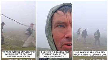 Tourist asking for help with camera set up to monitor brown bears bkg Tourist asking for help with camera set up to monitor brown bears bkg