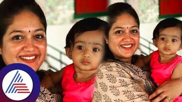 Kannada actress Meghana Raj meets Dhruva Sarja daughter vcs Kannada actress Meghana Raj meets Dhruva Sarja daughter vcs