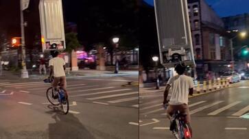 netizens amazed Balancing power of young man who Travelling on a bicycle with a fridge on the head akb netizens amazed Balancing power of young man who Travelling on a bicycle with a fridge on the head akb