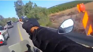 Dramatic Israeli cop fires gun from moving bike in shootout with Hamas operatives amid war - WATCH snt Dramatic Israeli cop fires gun from moving bike in shootout with Hamas operatives amid war - WATCH snt