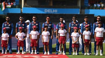 players wear black armbands to honor those who lost their lives in the Afghanistan earthquake rsk players wear black armbands to honor those who lost their lives in the Afghanistan earthquake rsk