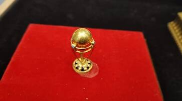 Ahmedabad jeweller Rauf Sheikh wants to present 0.9 gram weighing Worlds smallest gold World Cup trophy to indian captain Rohit Sharma during IND vs PAK Match rsk Ahmedabad jeweller Rauf Sheikh wants to present 0.9 gram weighing Worlds smallest gold World Cup trophy to indian captain Rohit Sharma during IND vs PAK Match rsk