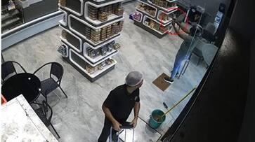 man entered a shop with gun and fled seconds after whole incident captured in cameras installed afe man entered a shop with gun and fled seconds after whole incident captured in cameras installed afe