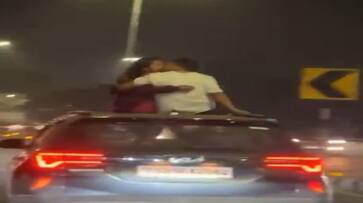 Hyderabad Video of couple kissing on moving car roof goes viral ksm Hyderabad Video of couple kissing on moving car roof goes viral ksm