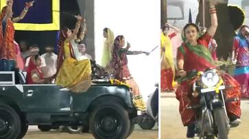 Gujarat women perform unique form of Garba dance in bikes and jeeps holding swords during Navratri prn Gujarat women perform unique form of Garba dance in bikes and jeeps holding swords during Navratri prn