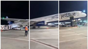 Viral video of the plane s rear end sticking up as the passengers begin to disembark bkg Viral video of the plane s rear end sticking up as the passengers begin to disembark bkg