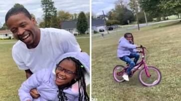 dad helps visually challenged daughter to ride a bicycle rlp dad helps visually challenged daughter to ride a bicycle rlp