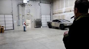 WATCH Elon Musk enjoys cigar as Joe Rogan tests Tesla Cybertruck's resilience with an arrow snt WATCH Elon Musk enjoys cigar as Joe Rogan tests Tesla Cybertruck's resilience with an arrow snt