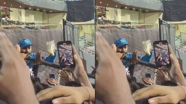 Rohit Sharma gifting his shoe to a young fan after India won against Sri Lanka in Wankhede Stadium video going viral rsk Rohit Sharma gifting his shoe to a young fan after India won against Sri Lanka in Wankhede Stadium video going viral rsk