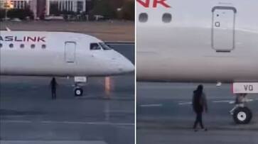 woman Arrested who running under the flight in Australian airport after she miss the flight video goes viral in Social Media akb woman Arrested who running under the flight in Australian airport after she miss the flight video goes viral in Social Media akb