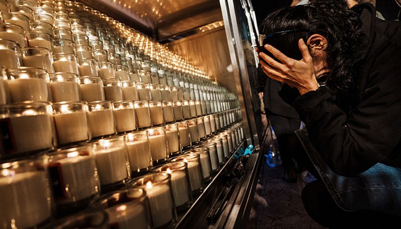 Faces of Israeli hostages projected on Jerusalem walls, candle-light vigil marks 1 month since Hamas attack snt