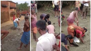 viral video of villagers carrying cement and construction materials for road construction to home bkg viral video of villagers carrying cement and construction materials for road construction to home bkg