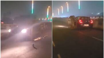 Video shows car dragging Police barricade on flyover viral btb Video shows car dragging Police barricade on flyover viral btb
