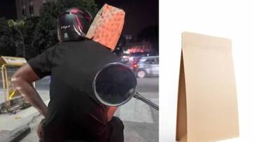pillion rider wears paper bag as helmet in Bengaluru - bsb pillion rider wears paper bag as helmet in Bengaluru - bsb