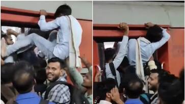 man desperate attempt to enter train watch viral video btb man desperate attempt to enter train watch viral video btb