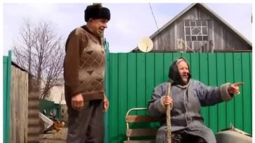 old couple living alone in a vast grassy village bkg old couple living alone in a vast grassy village bkg