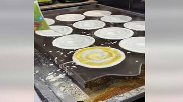 Chef using broom to clean tawa and making dosa with too much ghee video goes viral smp Chef using broom to clean tawa and making dosa with too much ghee video goes viral smp