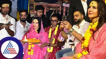 Sunny Leone attends Ganga Aarti with Abhishek Singh in Varanasi after release of new music video Third Party vvk Sunny Leone attends Ganga Aarti with Abhishek Singh in Varanasi after release of new music video Third Party vvk