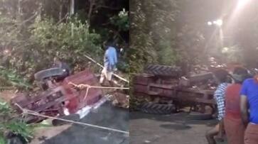 Tractor coming to Sabarimala overturns downhill on forest road, driver injured Tractor coming to Sabarimala overturns downhill on forest road, driver injured