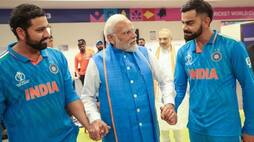 PM Modi holds Rohit sharma and Virat kohli hands during Team india Dressing room visit after world cup defeat ckm 