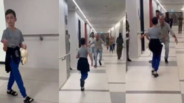 Israeli boy held hostage by Hamas runs to reunite with family smp