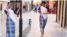 viral photoshoot of Malayali girl on London streets wearing lungi and blouse 