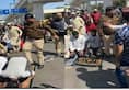 Viral Video Delhi Police Cop was seen hitting and kicking people offering Namaz at road [WATCH] nti