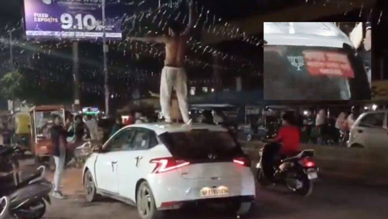 Drunk semi-naked couple in Prayagraj shower each other with alcohol on a car with a BJP sticker-rag