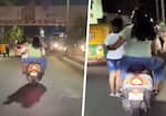 SHOCKING Bengaluru couple rides scooter with child standing on footrest, netizens furious (WATCH) gcw