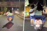 SHOCKING Bengaluru couple rides scooter with child standing on footrest, netizens furious (WATCH) gcw