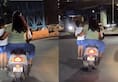 Bengaluru couple rides scooter with child standing footrest, Internet puzzled; WATCH viral videortm