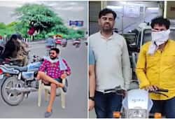 man makes reel sitting on chair In middle of road arrested