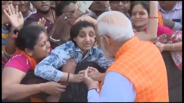 Modi talks with a blind girl after casting his vote in Ahmedabad sgb