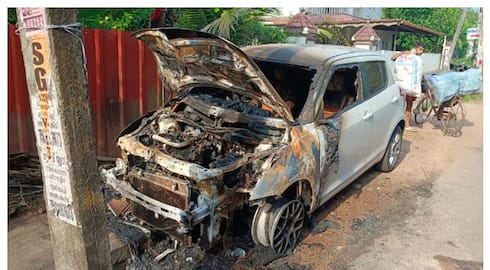 car parked on the roadside catches fire