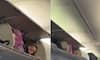 Viral video: American woman climbs into luggage compartment of plane to take a nap [watch}