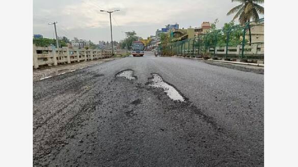 Poor asphalting work on Bengaluru Mysore highway exposed due to rain gvd