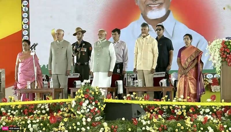 After taking an oath as AP Chief Minister, Chandrababu Naidu seeks to touch PM Modi's feet but is given a loving hug instead-rag