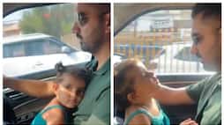 Social media criticize the video of a man drive the car with her daughter sitting on her lap 