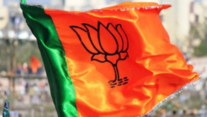 Police official pays the price of destroying BJP flag post suspended Police official pays the price of destroying BJP flag post suspended