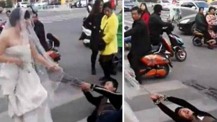 Bride drags groom through the streets in chains after he doesnt show up to wedding Bride drags groom through the streets in chains after he doesnt show up to wedding