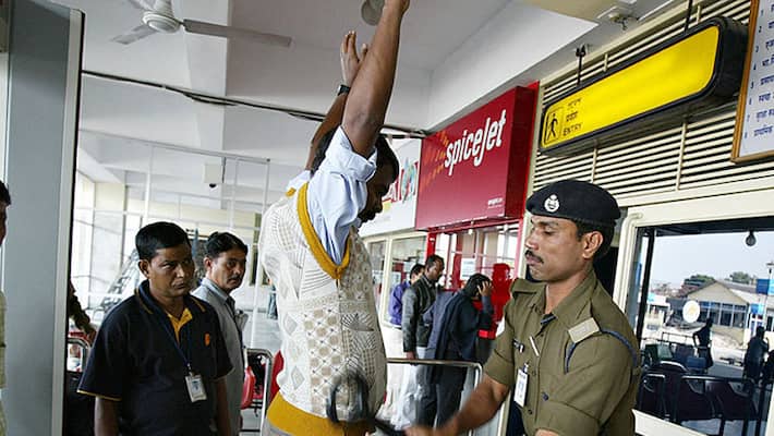 woman passenger alleges was forced to take off shirt at bengaluru airport while checking, cisf counters back woman passenger alleges was forced to take off shirt at bengaluru airport while checking, cisf counters back