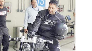 MS Dhoni giving lift to his Ranchi Farm House security guard on his bike Video goes viral MS Dhoni giving lift to his Ranchi Farm House security guard on his bike Video goes viral
