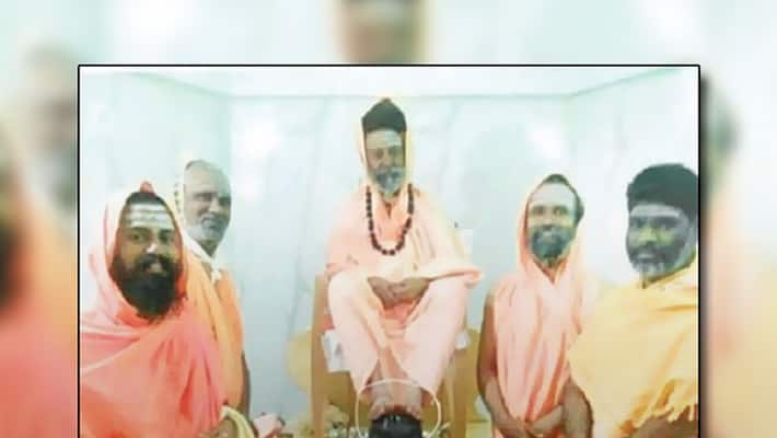 Seer places his feet on Linga says it is their ritual devotees angry Seer places his feet on Linga says it is their ritual devotees angry