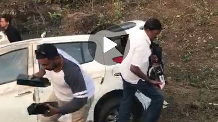 thieves steal liquor bottles after a car carrying bottles met with accident thieves steal liquor bottles after a car carrying bottles met with accident